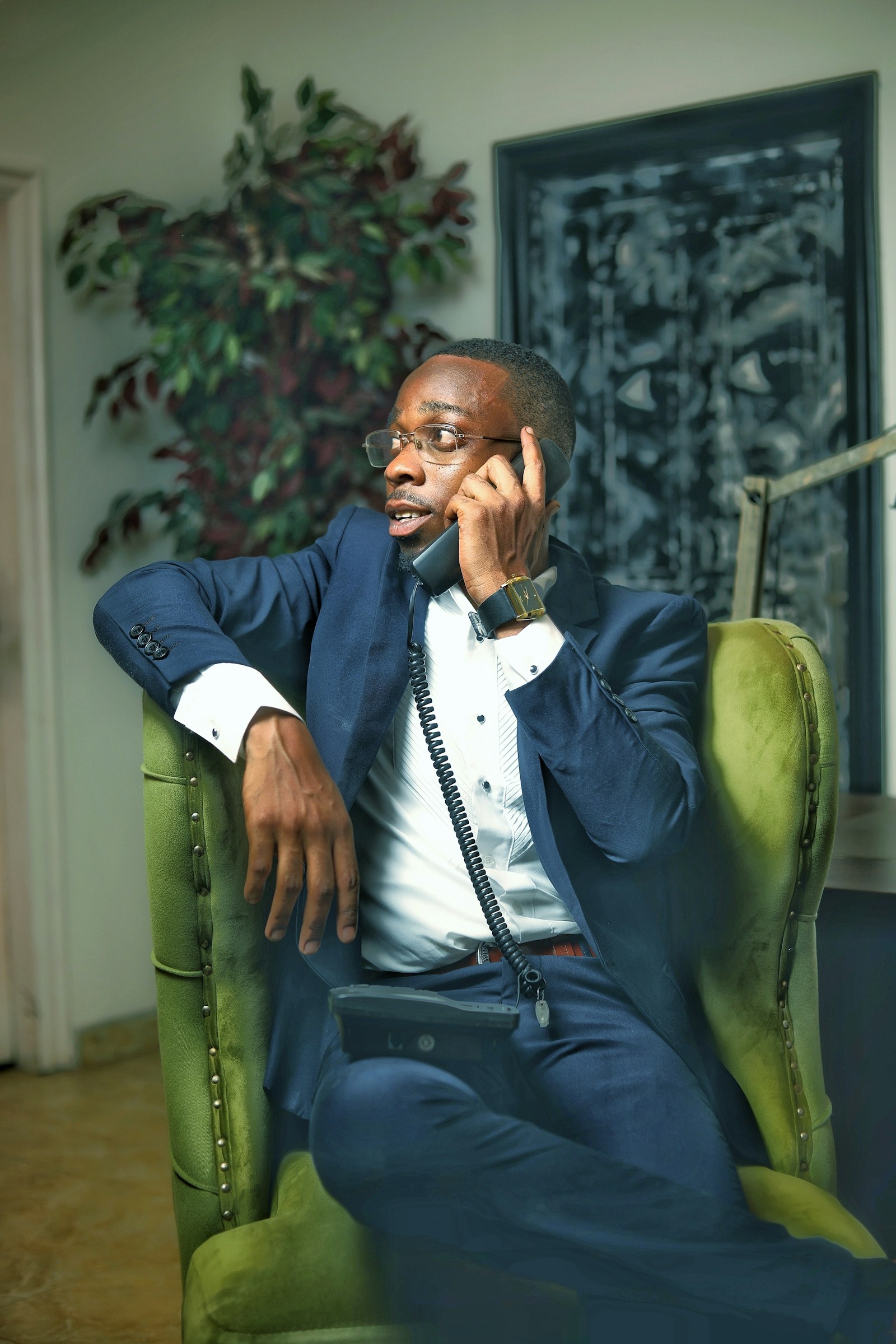 A Ghanaian professional reviewing finances on a phone