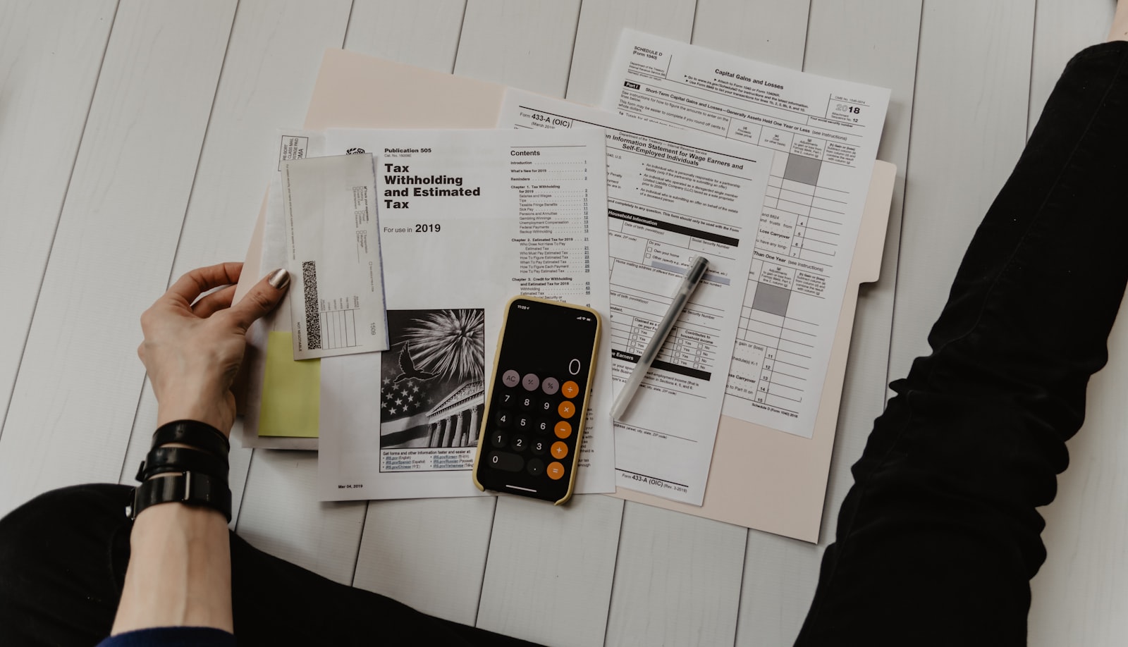 Canadian financial paperwork beside a calculator and pen